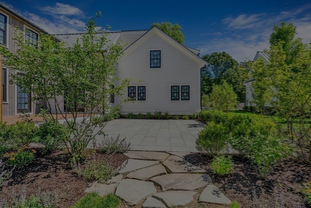 An irregular flagstone path set through planted beds.